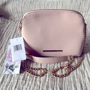 Kensie crossbag.With multiple packets.